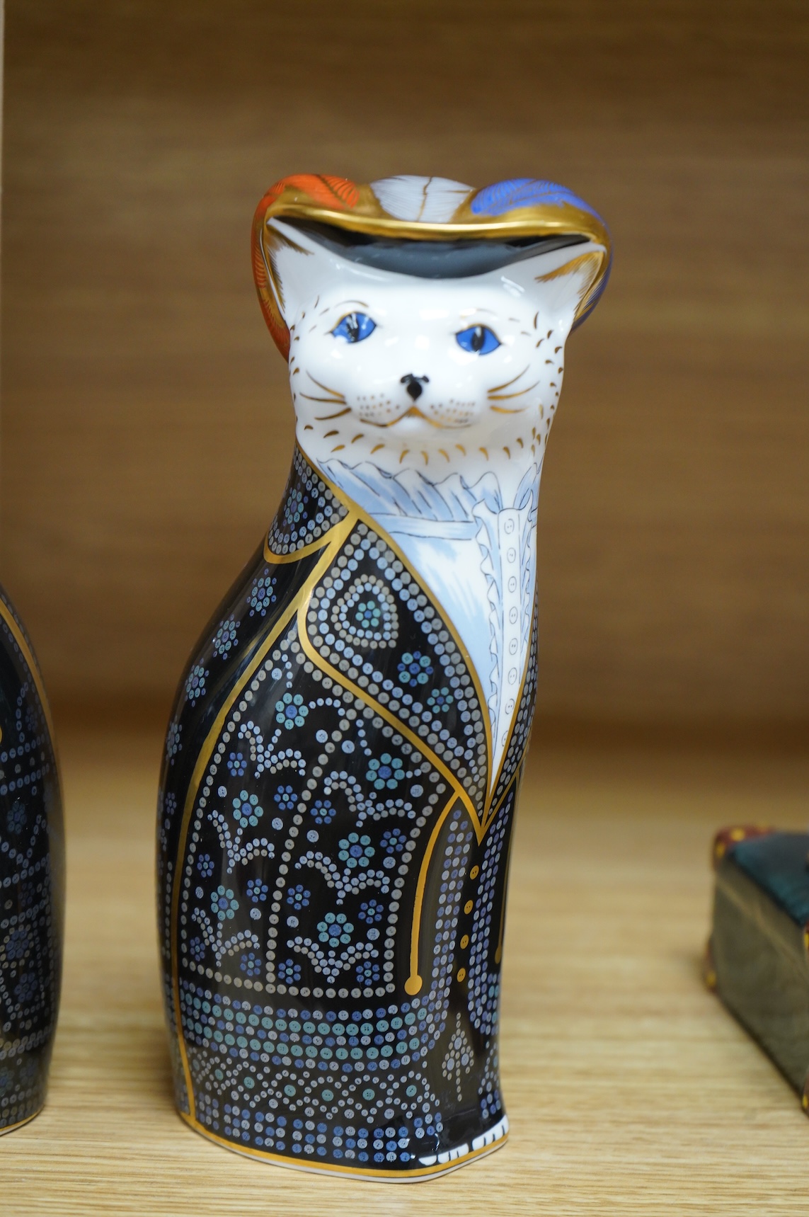Two Royal Crown Derby cats compromising Pearly Queen and King, one with stopper, largest 20cm high